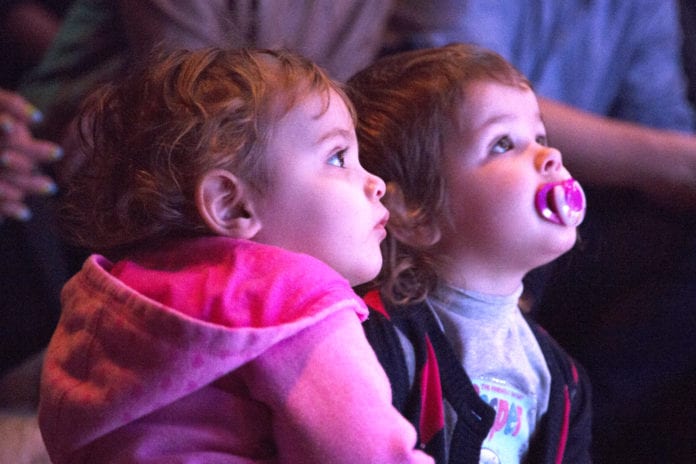 Children captivated by a performance