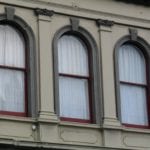Shop_facades_next_to_Bank_of_New_Zealand_building,_Port_Chalmers,_windows