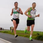 Racing towards victory in Run Galway Bay on Saturday Michael Canty from Moy Valley, beinig chased by Raheny’s Brian Leahy Pic Credit Cathal Bowe