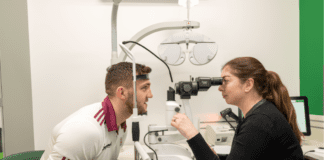 Damien Comer teams up with Specsavers to shine light on eye and hearing health galway daily news damien comer visits specsavers store in headford