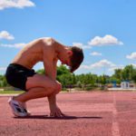 exhausted-athlete-crouching-on-track-after-intense-2024-11-26-02-12-29-utc